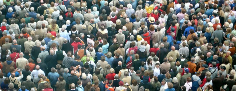 Crowded tourists overwhelming an iconic destination, highlighting the impact of mass tourism and the need for sustainable travel solutions