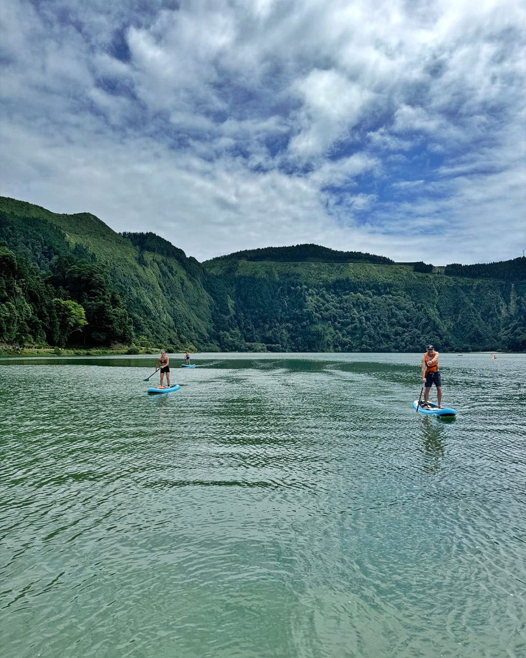 A group exploring the scenic volcanic landscapes of the Azores on a small group tour