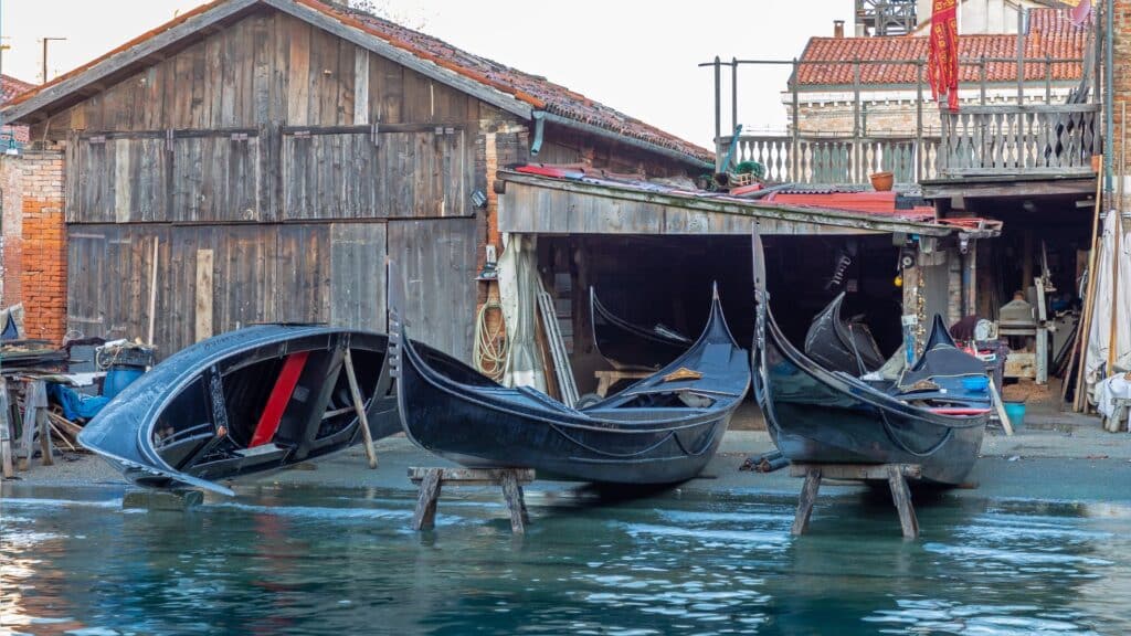 Gondolas being repaired at the historic Squero di San Trovaso in Venice.