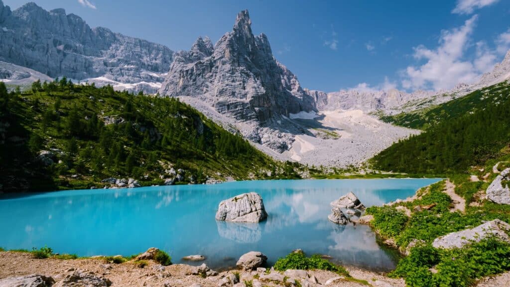 Lago di Sorapis in the Dolomites with blue water and spring mountains, perfect for travel to the Dolomites and exploring Alpine Lakes.