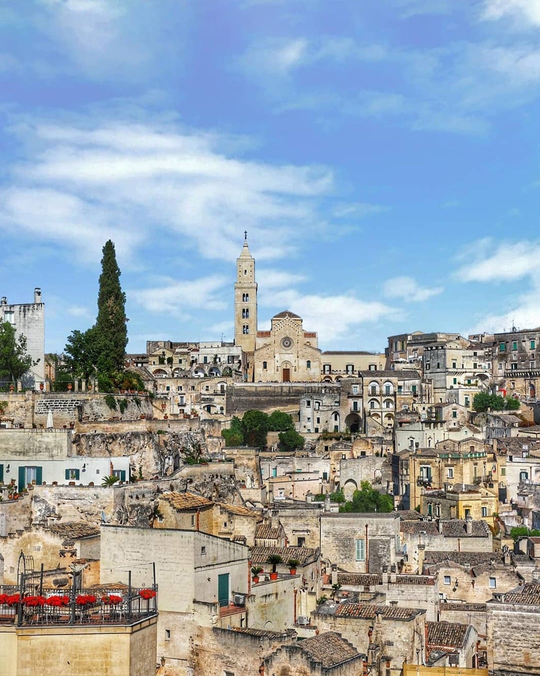 Panoramic view of historic Matera with ancient stone houses and winding streets, part of a small group tour in Puglia