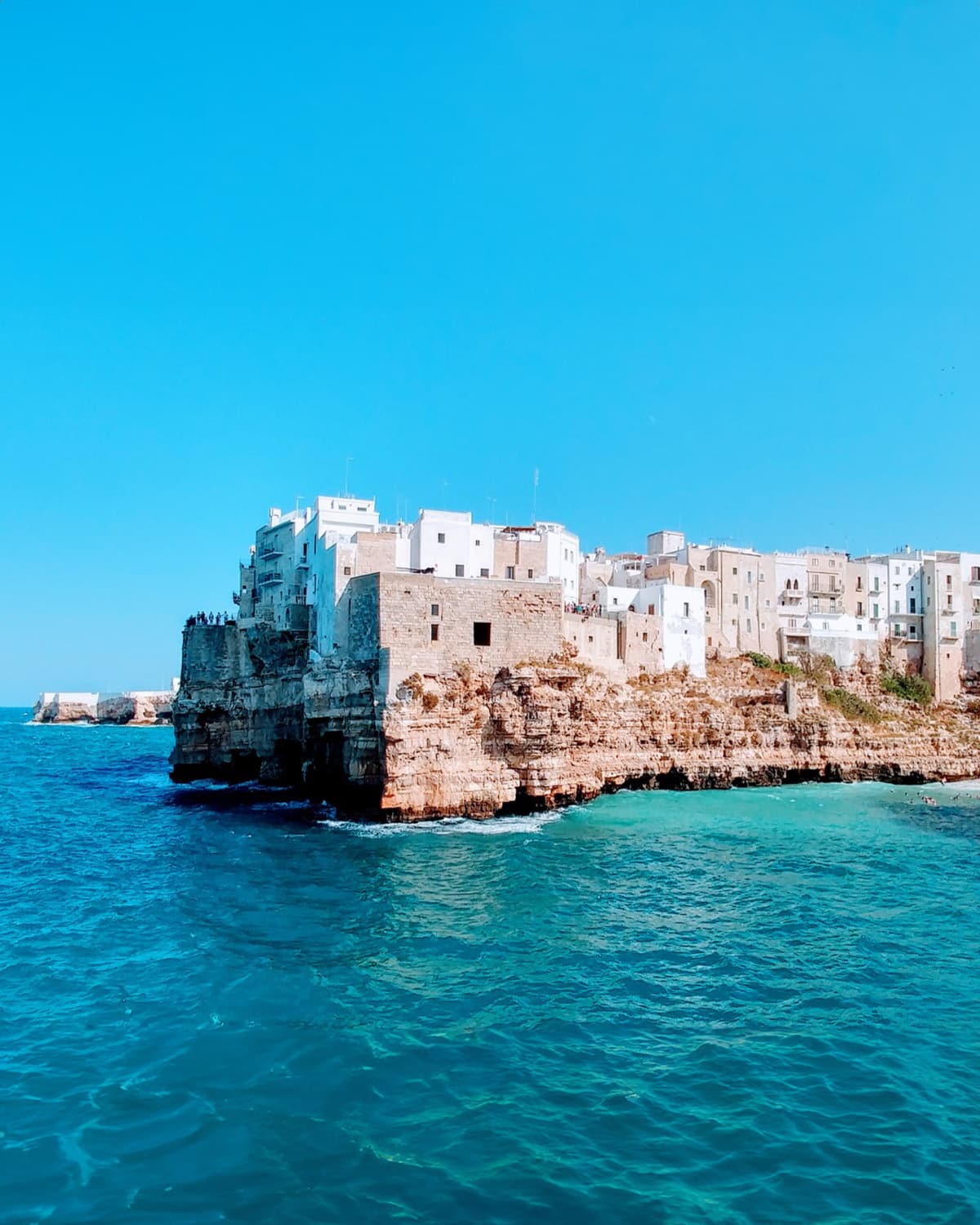 Panoramic view of historic Matera with ancient stone houses and winding streets, part of a small group tour in Puglia