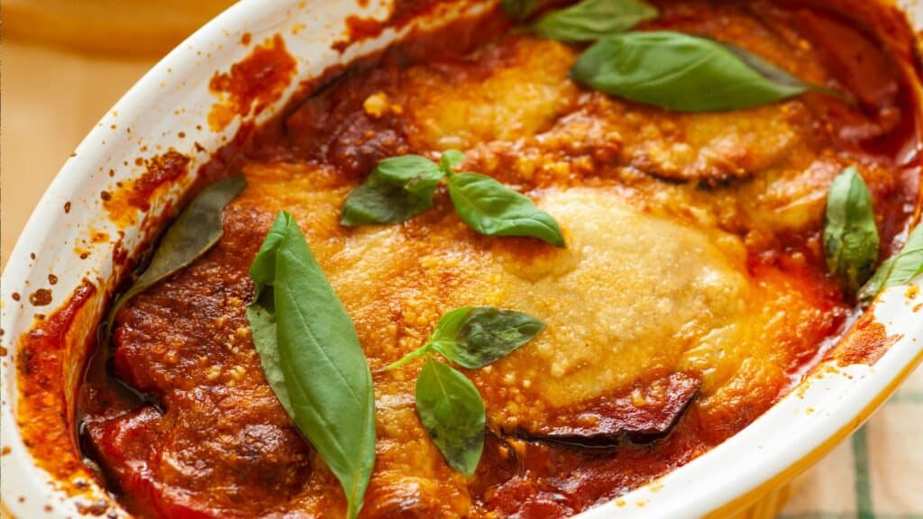 Travel to Amalfi Coast and Napoli to savor authentic Italian cuisine like Parmigiana di Melanzane, a traditional Southern Italian dish.