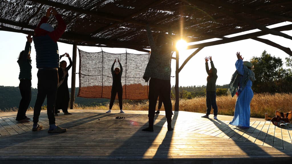 Participants Enjoying A Yoga Retreat In The Peaceful Surroundings Of Almières, France, As Part Of A Small Group Trip Focused On Adventure Travel And Wellness.