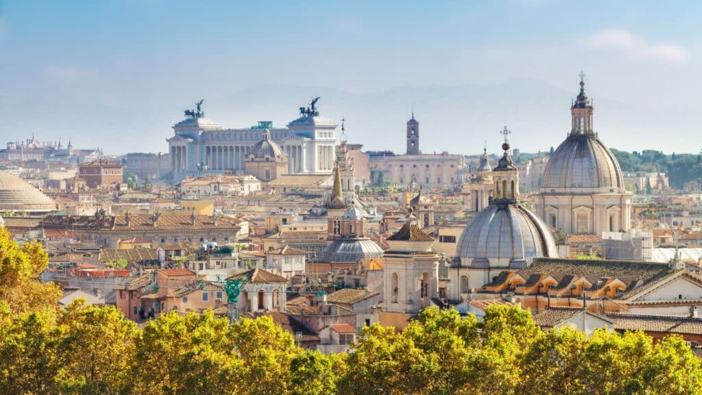 Panoramic View Of Rome Rooftops With A Clear Sky, Showcasing An Authentic Italian Experience Through Personalized Travel Planning.