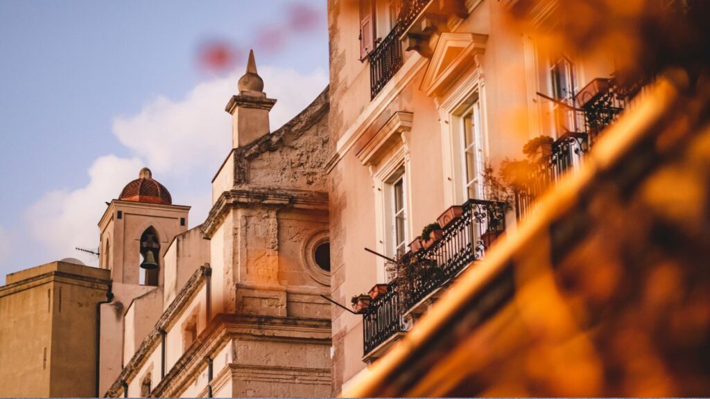 A breathtaking view of Cagliari, Sardinia’s capital, showcasing its historic architecture and the sparkling blue waters of the Mediterranean.