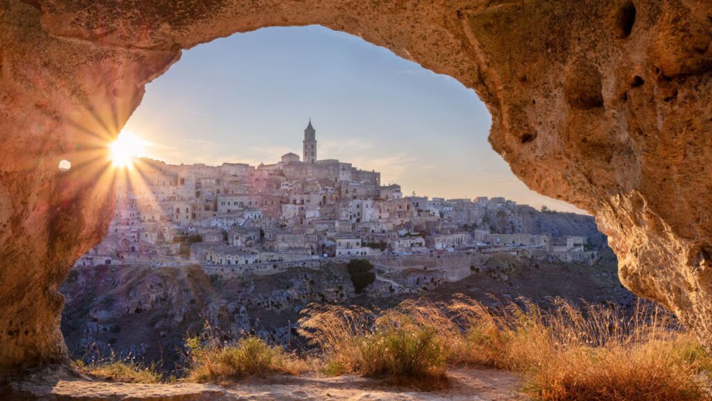 Golden Sunset Over The Ancient City Of Matera, Perfect For Traveling In Italy With Carry-On Only